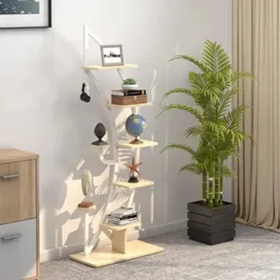 A multi-tiered plant stand with various decorative items and a potted plant in a room.