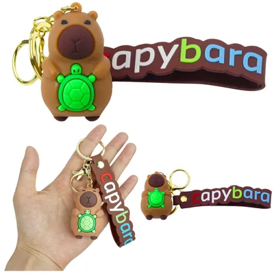 Immagine prodotto di Portachiavi con figurina di capibara e tartaruga, anello moschettone