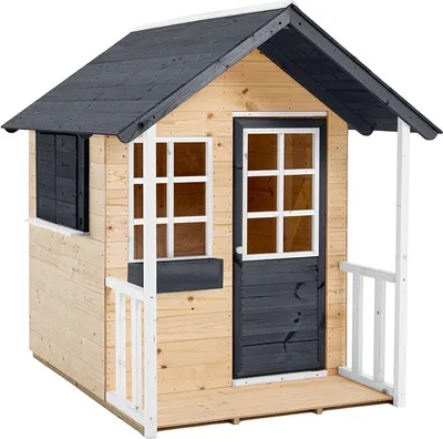 A wooden playhouse for children in a garden.