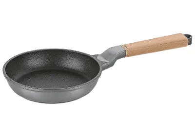 A frying pan with a wooden handle is shown against a white background.