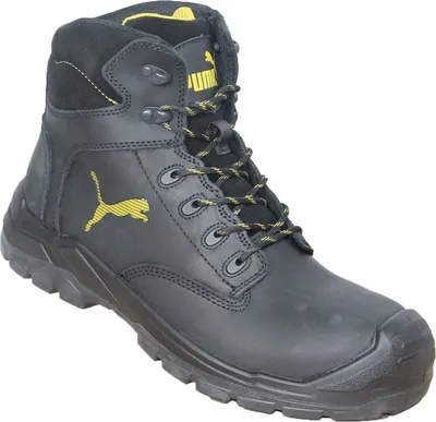 A black Puma safety boot with yellow accents.
