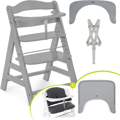 A grey high chair with accessories laid out around it.