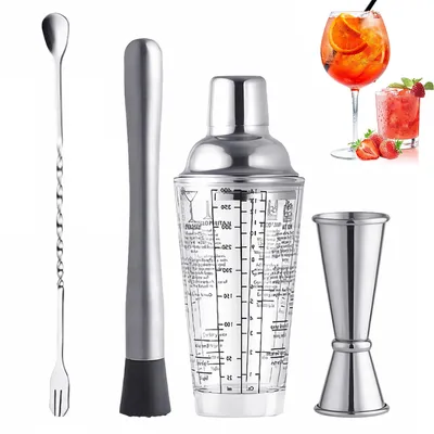 A set of cocktail making tools including a shaker, muddler, jigger, and bar spoon, along with two cocktail drinks and strawberries in the background.