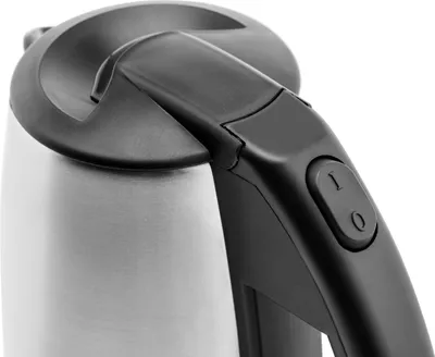 A close-up shot of the handle and top of a silver and black electric kettle.