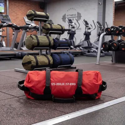 Produktbild von Trainingssandsack - Verstellbare Gewichtstasche - Mehrere Griffe - Ungefüllt - Für Cross-Training und Homegym - Rot