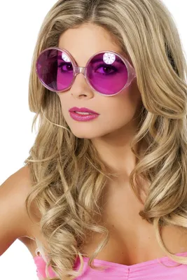 A woman wearing large, round, pink sunglasses.