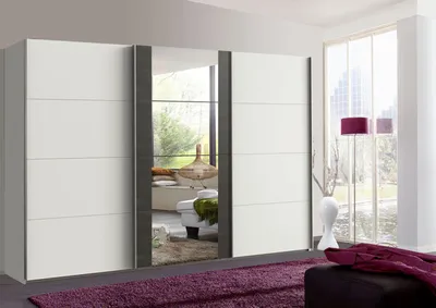 A modern wardrobe with mirrored doors in a bedroom setting.
