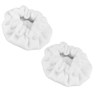 Two white, fluffy cleaning pads for a steam cleaner.