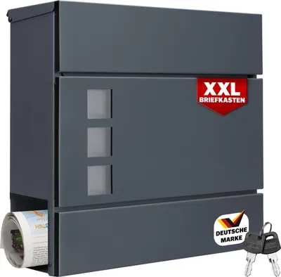 A dark gray XXL mailbox with a newspaper compartment and a label indicating it is a German brand.