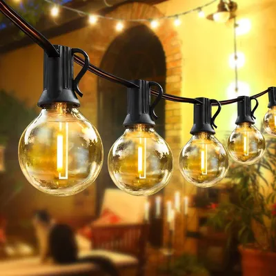 Immagine prodotto di Catena luminosa da 20 metri - 30+4 lampadine G40 - Con spina - Grado di protezione IP65 (resistente all'acqua) - Luce bianco caldo - Adatta per interni ed esterni