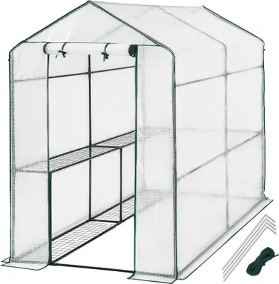A greenhouse with shelves, stakes, and rope.