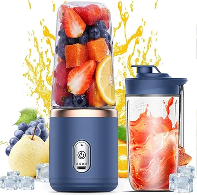 A blue portable smoothie maker filled with fruit, next to a glass of smoothie and surrounded by fruit and ice cubes, with yellow splashes in the background.