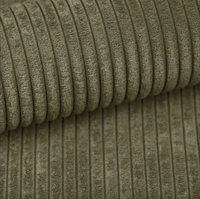 A close-up shot of olive green corduroy fabric.