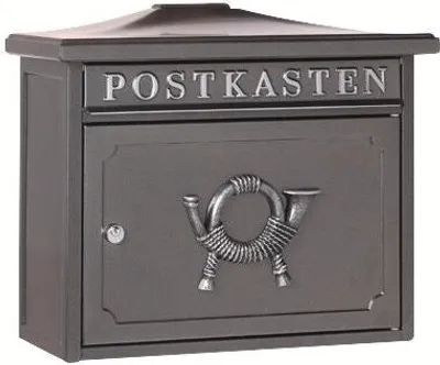 A dark gray mailbox with a decorative horn emblem and the word "POSTKASTEN" on the front.