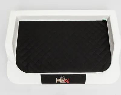 A dog bed with a black quilted cushion inside a white frame, placed on a white background.