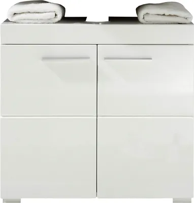 A clean, minimalist studio shot of a white vanity cabinet with towels on top.