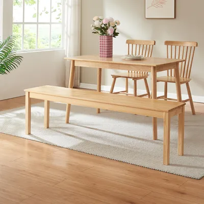 A dining room setting with a wooden bench, table, and chairs.