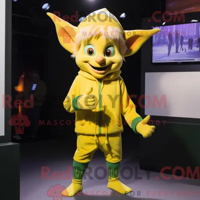 Immagine prodotto di Personaggio in costume mascotte REDBROKOLY elfo giallo vestito con un maglione e spille