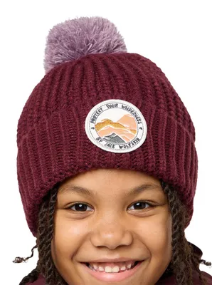 Zdjęcie produktu dla Czapka zimowa Jack Wolfskin Uni dla dzieci, model Kinder Pompom Badge K, kolor Boysenberry, rozmiar M (EU)