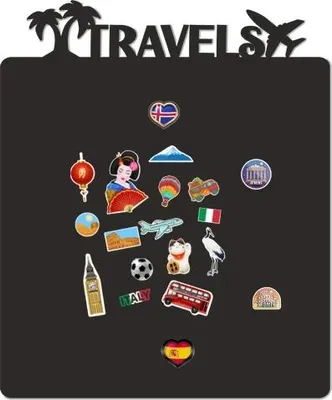 A black magnetic board with various travel-themed magnets and the word 'TRAVELS' at the top.