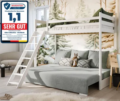 A bunk bed with a sofa underneath, set in a room with a forest-themed wallpaper.