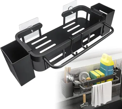 A black kitchen sink organizer with multiple compartments and hooks, shown mounted on a countertop.