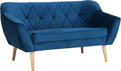 A blue velvet sofa with wooden legs is shown against a white background.