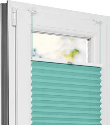 A close-up view of a turquoise pleated blind installed in a white window frame.