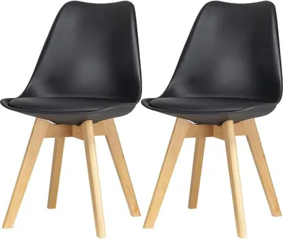 Two black dining chairs with wooden legs are shown against a white background.