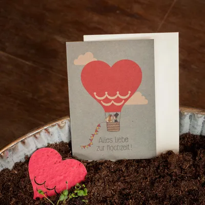 Produktbild von Die Stadtgärtner – Hochzeitskarte mit Saatpapier I Schöne Karte zur Hochzeit mit Heißluftballon-Motiv I Saatpapier mit hochwertigen Wildblumen-Samen I Karte mit Umschlag I 10,5 x 14,8 cm (DIN A6)