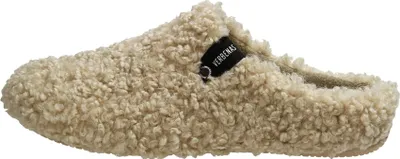 A side view of a beige, fluffy slipper.