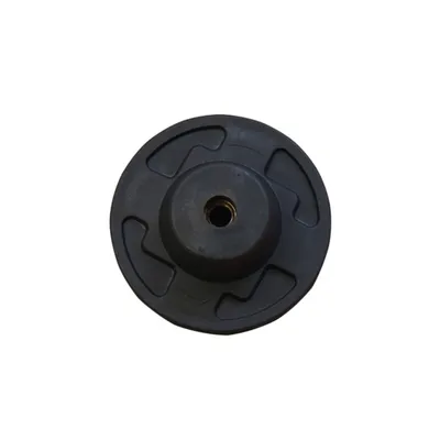 A top-down view of a black, circular object with a threaded hole in the center.