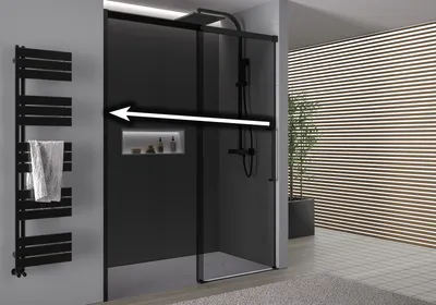 A modern bathroom with a black framed shower enclosure, a black towel warmer, and a plant in the background.