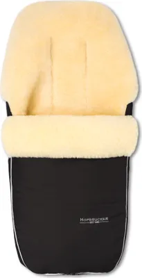 A black and cream colored baby footmuff for a stroller or buggy.