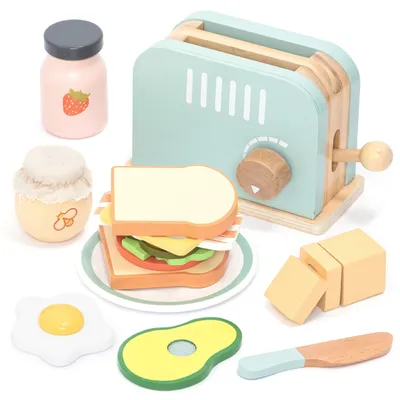 A collection of wooden toy food items for breakfast, including a toaster, sandwich, fried egg, avocado, butter, and jars of jam and honey.