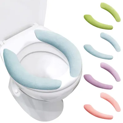 A toilet seat with light blue covers and several colorful toilet seat covers displayed next to it.