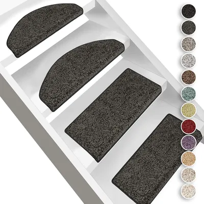 A collage of stair mats in different shapes and colors, displayed on white stairs.