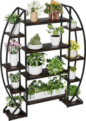 A multi-tiered plant stand filled with various potted plants.