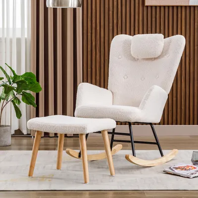 A white teddy plush rocking chair with a matching ottoman in a room with wood-paneled walls and sheer curtains.