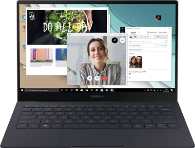 A laptop screen displaying multiple windows, including a video call, a web page, and an email client.