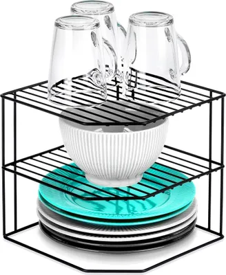 A black metal corner shelf unit holding kitchenware.