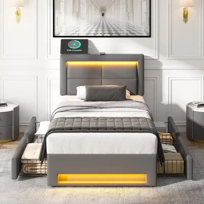 A modern bedroom setting featuring a grey upholstered bed with integrated LED lighting and a charging station.