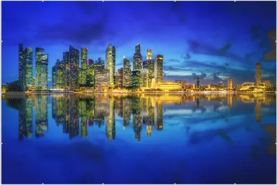Produktbild von Wallario Wandbild Skyline von Singapur in der Abenddämmerung, Größe: 61 x 91,5 cm, Poster mit rahmenlosen Bildhalter
