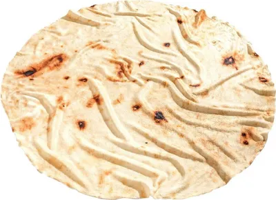 A close-up, overhead view of a large, round tortilla blanket.