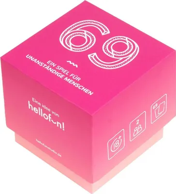 A pink cube-shaped box with white text and graphics, likely packaging for a game or product.