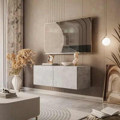 A modern living room with a wall-mounted TV cabinet, artwork, and decor.