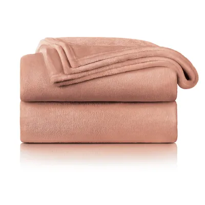 Two folded blankets are stacked on top of each other against a white background.