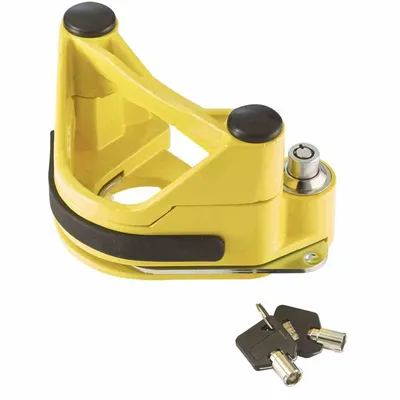 A yellow trailer hitch lock with two keys.
