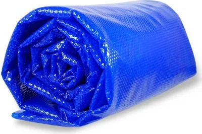 A rolled-up blue solar cover for a pool.