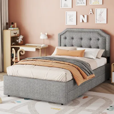 Imagen del producto de Cama tapizada Sweiko de 90 x 200 cm, diseño bajo, con acolchado en la mesita de noche y detalles decorativos de tachuelas, dos cajones, color gris
